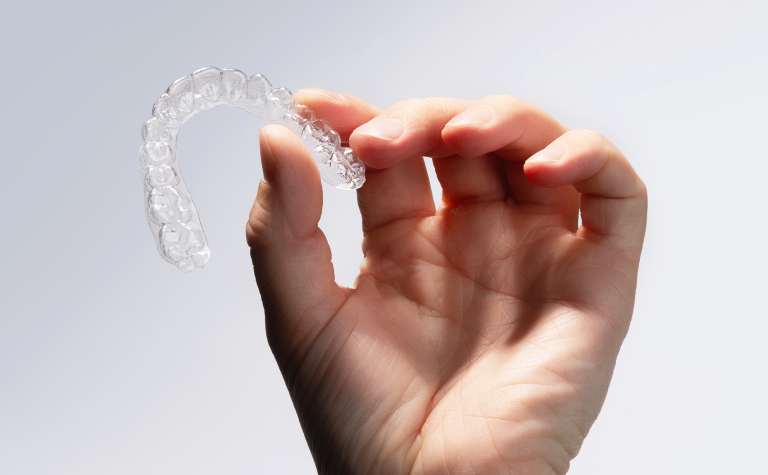 Clear Aligners held in hand